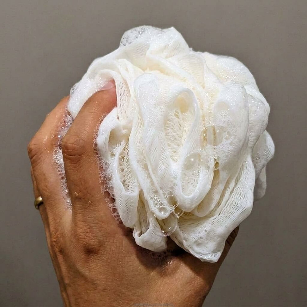 Customer using Albanua loofah sponge