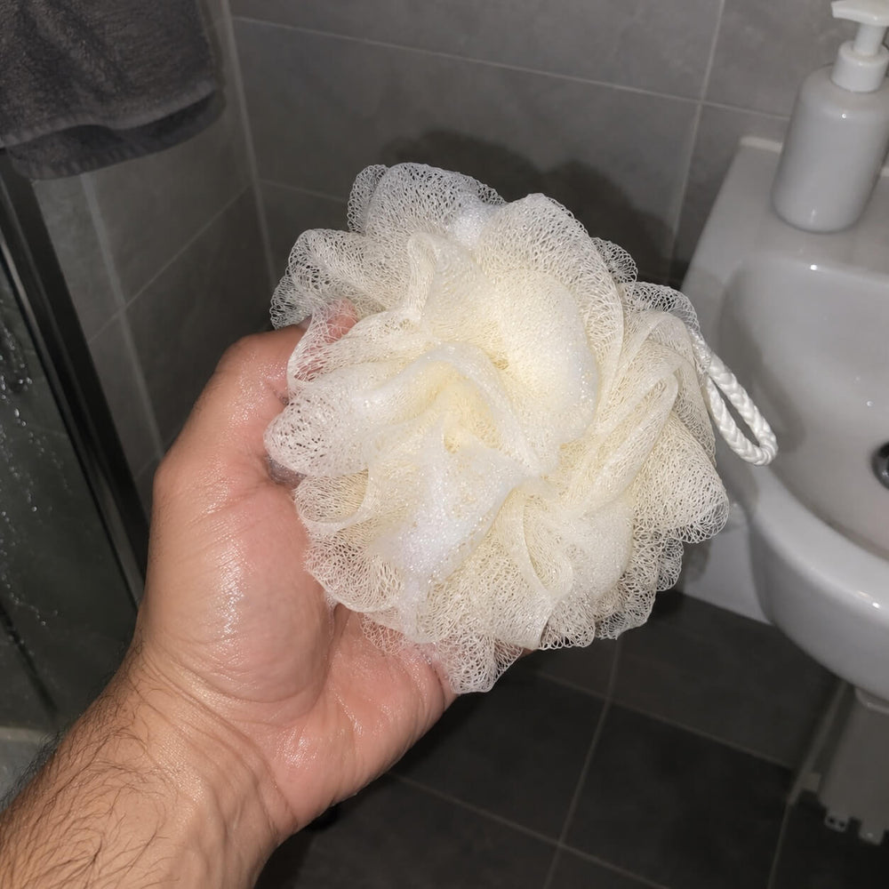 Customer using Albanua loofah sponge