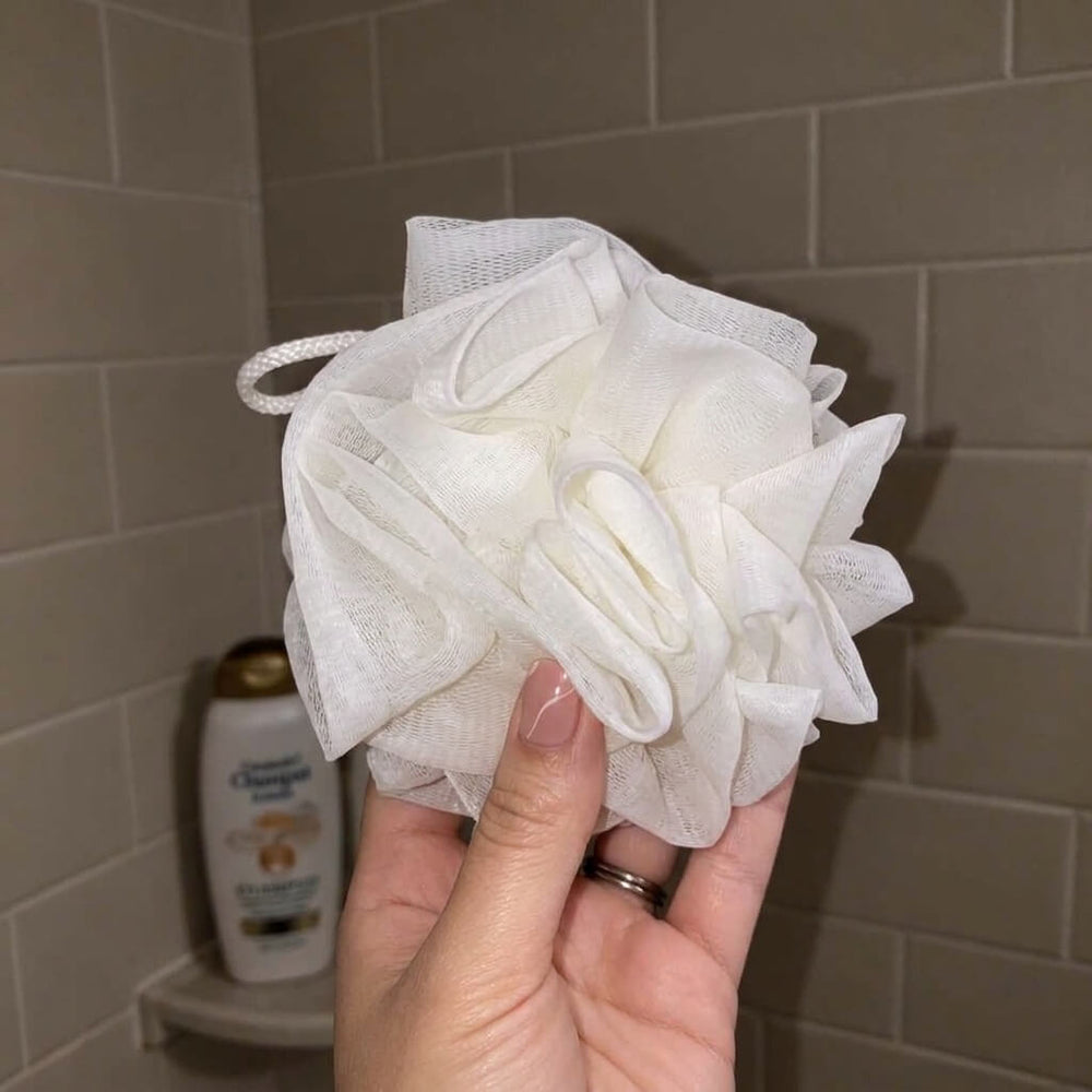 Customer using Albanua loofah sponge