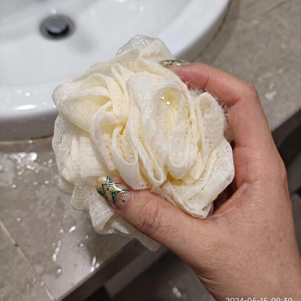 Customer using Albanua loofah sponge